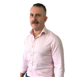 Nick Mascali Brisbane Physiotherapist Physiotherapist wearing a pink shirt